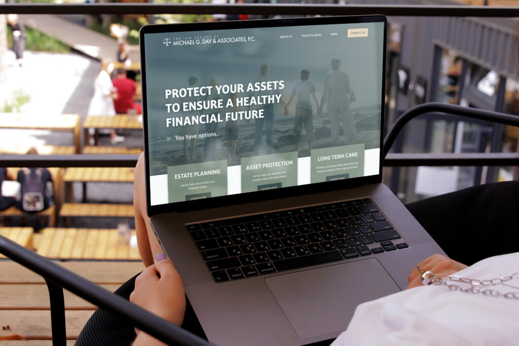 A laptop with the Michael G. Day & Associates, P.C. website being featured