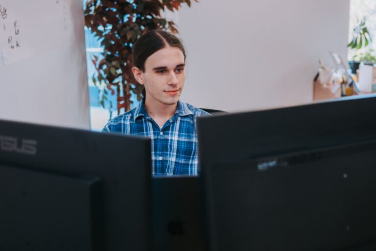 Sam at his desk